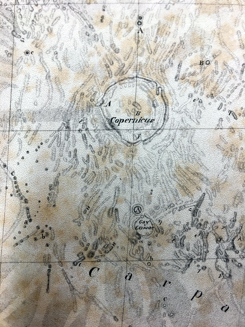 Mappa Selenographica totam Lunae hemisphaeram risibilem complectons chorratinibus propriis secundum projectionem othographicam quatuor Sectionibus constructa et delineata Suae Majestati Friderico Sexto regi daniae illustrissimo .... Guilelmo Beer et Joanne Henrico Mädler Ediio Genuina Berolini MDCCCXXXIV Ex autographico in lapudem inciduit Carolus Vogel Apud Simon Schropp et Soc